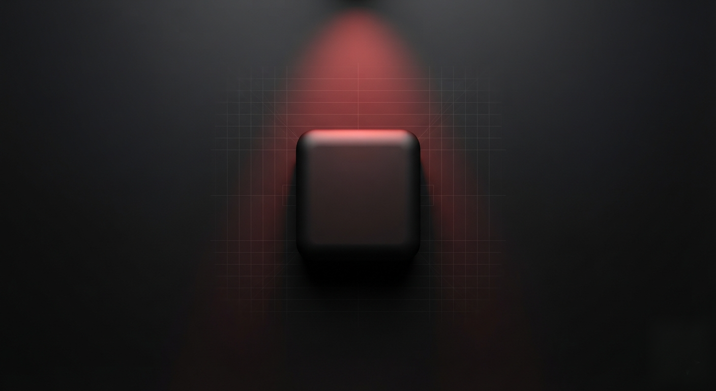 Overhead shot of a matte-black device prototype under a red spotlight on a minimalist work surface